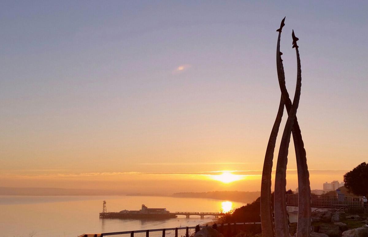 Pier sunset from the East Cliff with Red Arrows monument taken by Alan Edwards
