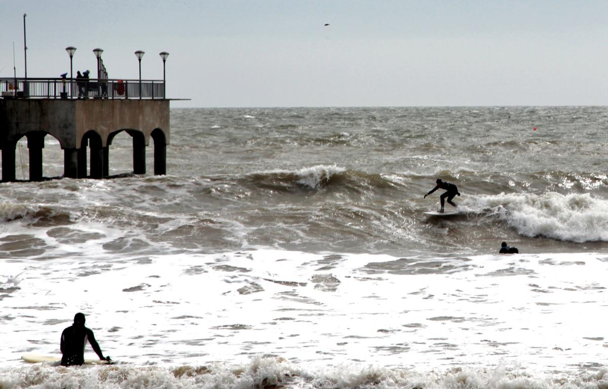 Surfers at Boscombe beach on a windy Sunday afternoon, captured By John Burge of Hamworthy