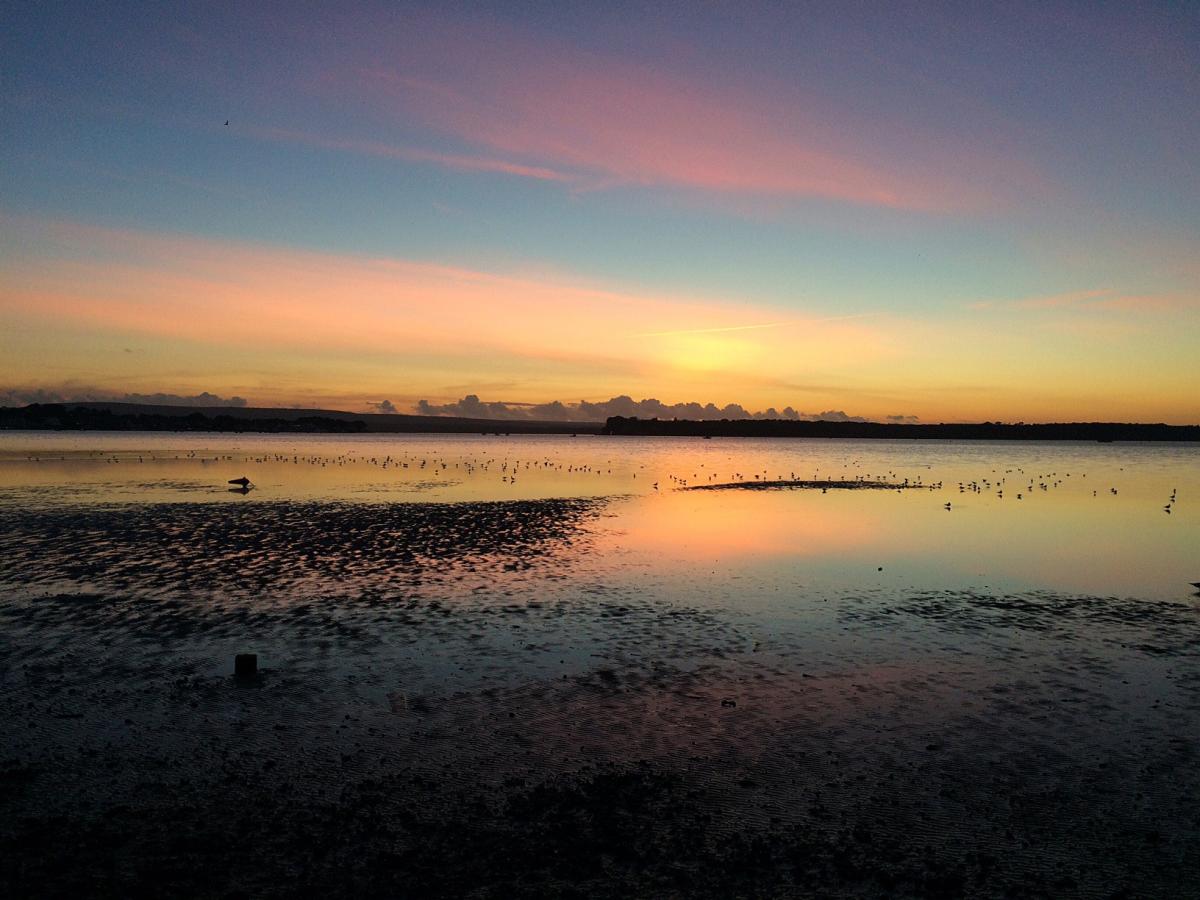 Sunset looking toward the Purbecks and Brownsea Island from Sandbanks  taken by Melissa Dean