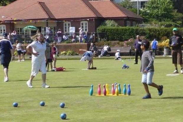 Youngsters learning bowling skills in a fun way