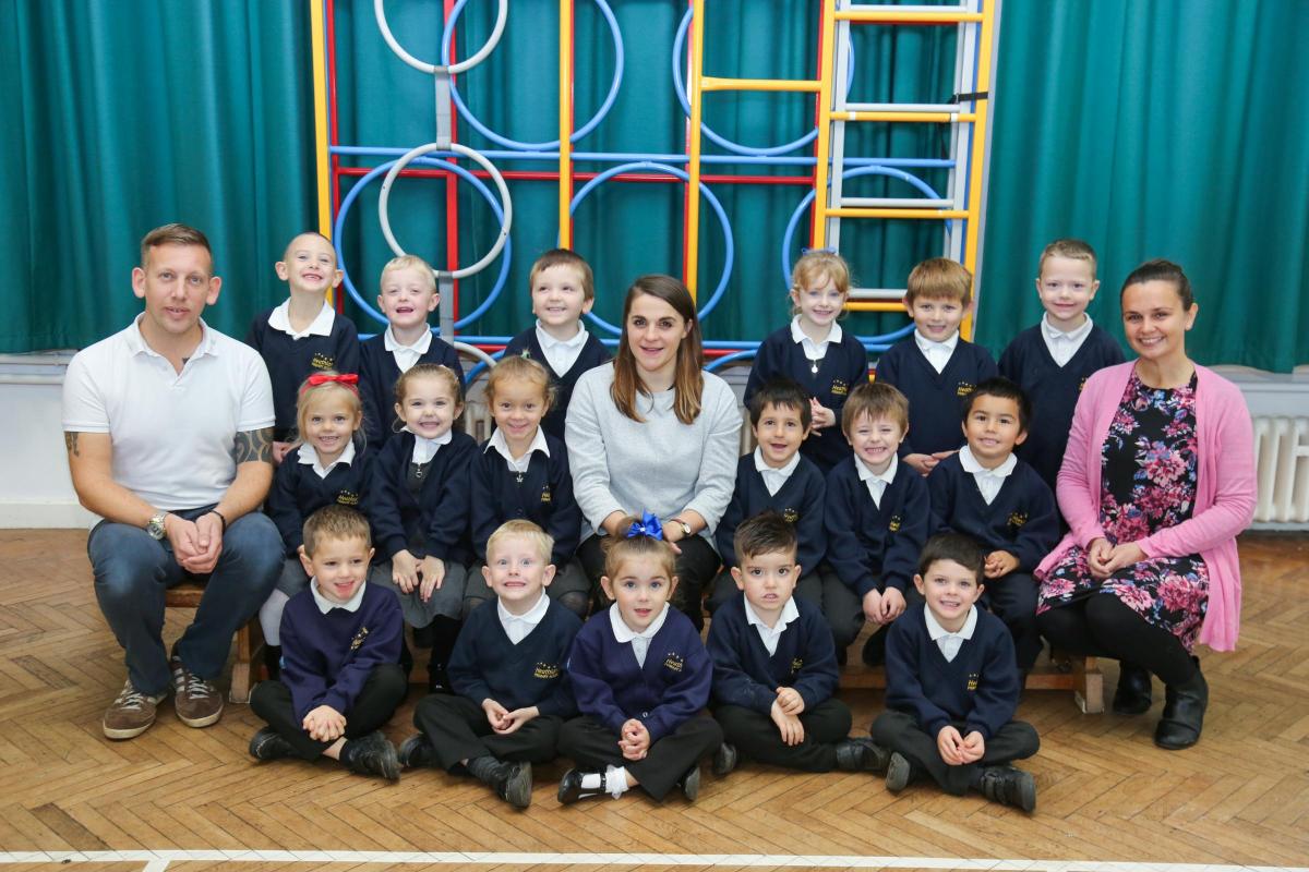 Reception children in Bumblebees class at Heathlands Primary Academy with teacher Sam Harvey, centre, and TA's Paul Gillingham and Clare Reeves.