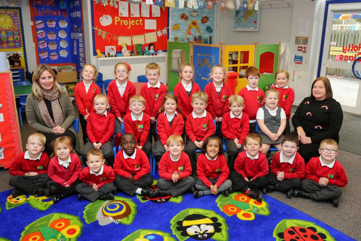 Reception children in Holly class at Sylvan Infant School in Poole with TA Tracey Collins and HLTA Fran Waters.