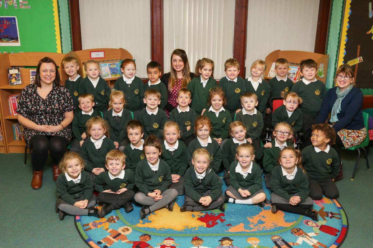 Reception children in Suns class at Ad Astra Infant school with teacher Miss Ramsden, centre, and TAs Mrs Lewis and Mrs Coleman