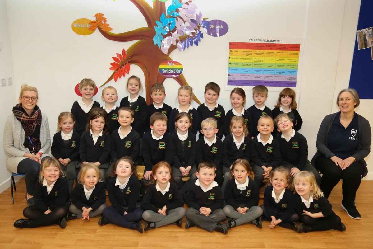 Reception children in Maple class at Pimperne CE Primary School with teacher Miss Lee and TA Mrs Brown.